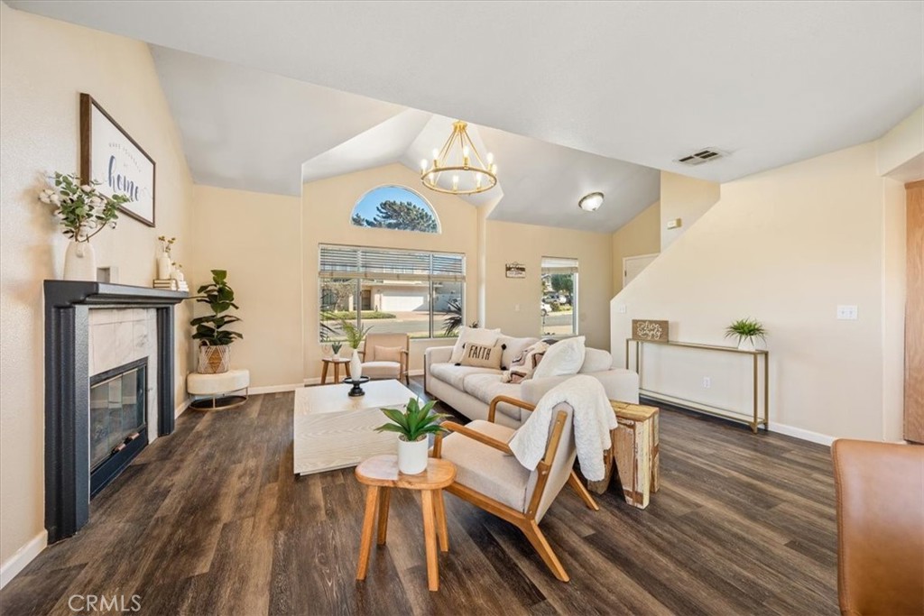 1306 Avenida Pelicanos Oceano, CA 93445 - Photo 6 of 39 a living room with fireplace furniture and a wooden floor