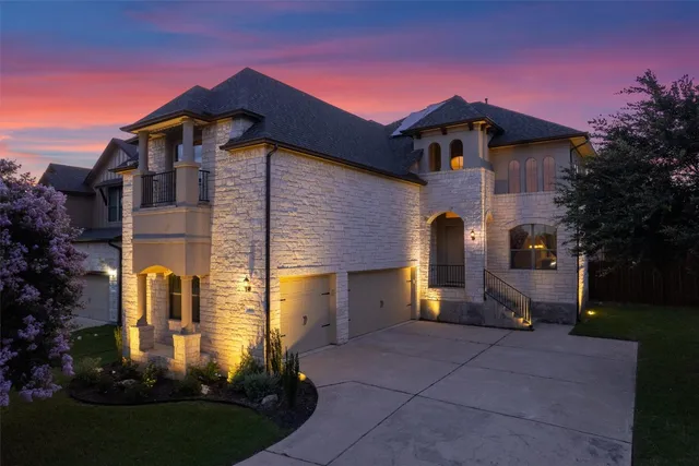 an aerial view of multiple houses with a yard
