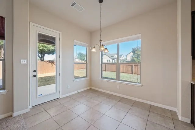 a bathroom with a double vanity sink a vanity and a mirror