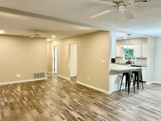 a kitchen with a table and chairs in it