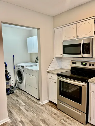 a view of storage and utility room with sink