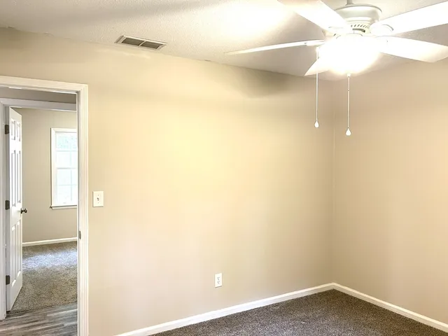 a view of a bathroom with a tub and shower