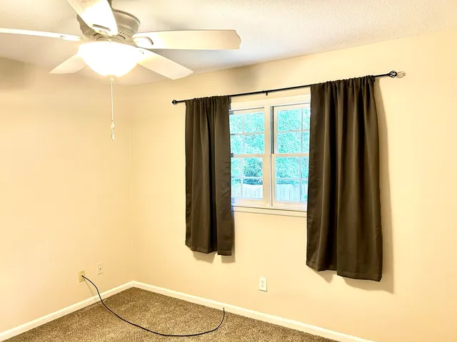 a bathroom with a shower and a sink