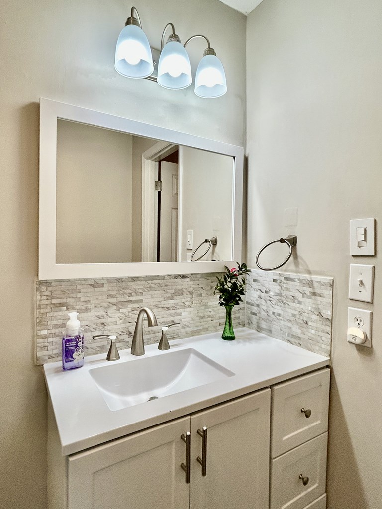 5636 Webb Avenue Columbus, GA 31909 - Photo 32 of 52 a bathroom with a sink and a mirror