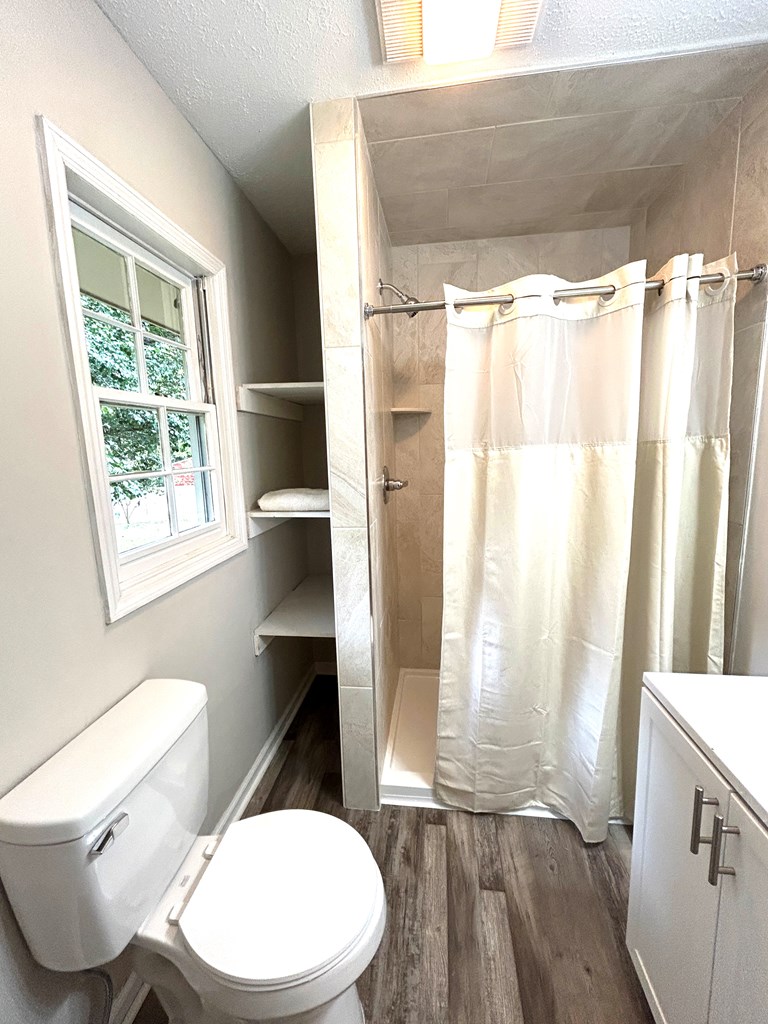 5636 Webb Avenue Columbus, GA 31909 - Photo 34 of 52 a bathroom with a toilet and a shower