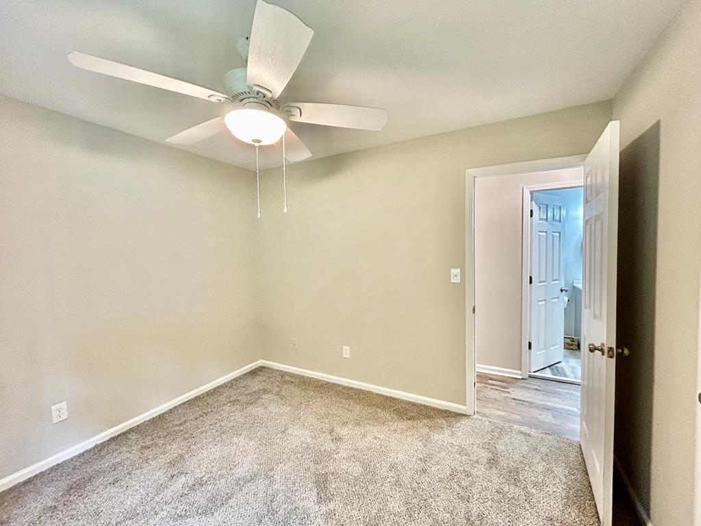 5636 Webb Avenue Columbus, GA 31909 - Photo 36 of 52 an empty room with a ceiling fan and a window