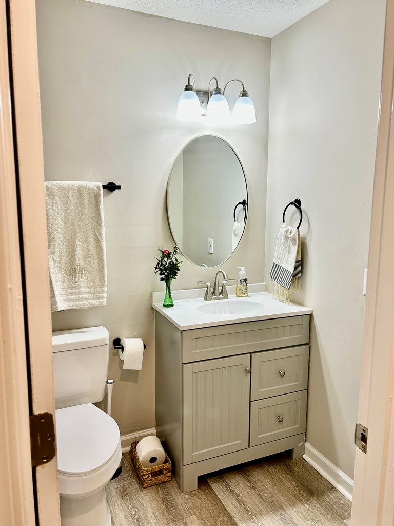 5636 Webb Avenue Columbus, GA 31909 - Photo 40 of 52 a bathroom with a toilet sink and mirror