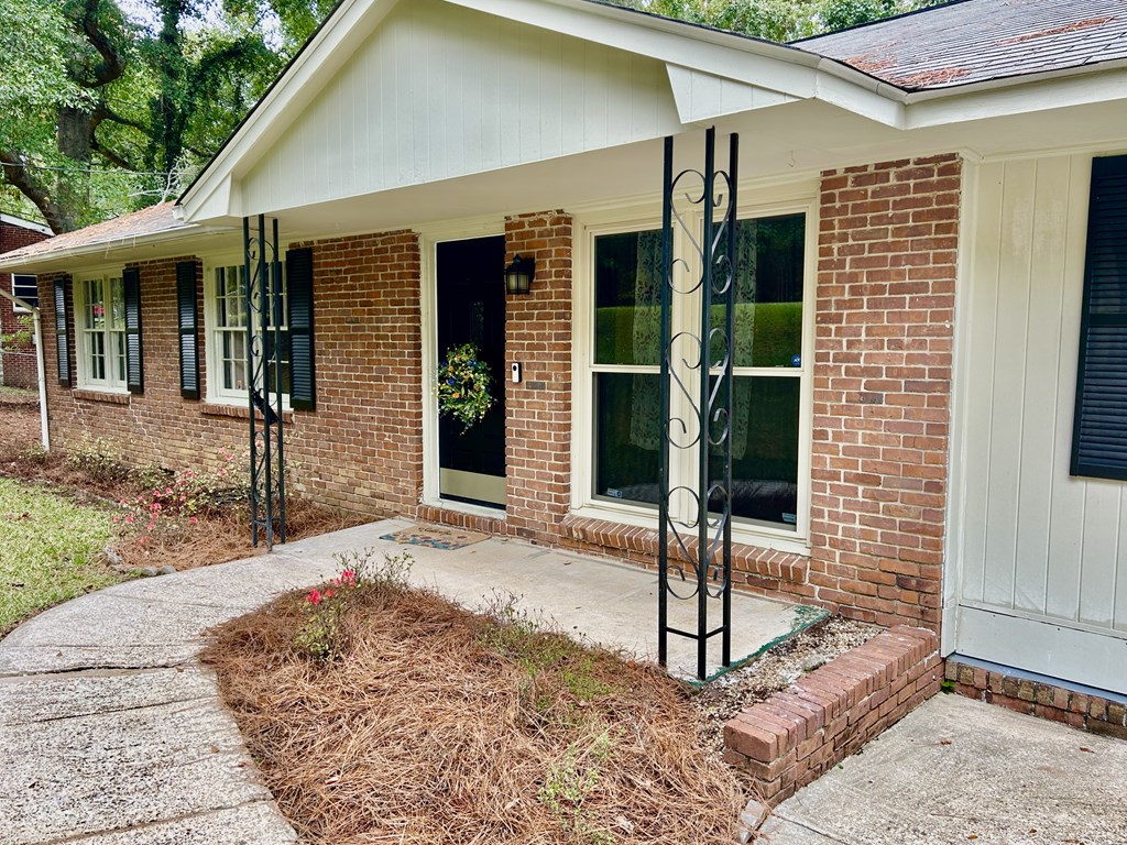 5636 Webb Avenue Columbus, GA 31909 - Photo 4 of 52 a view of a brick house with large windows