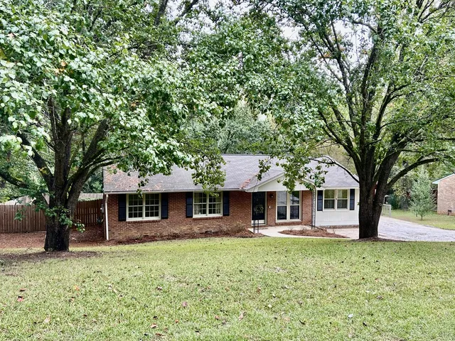 a view of a wooden door and bench
