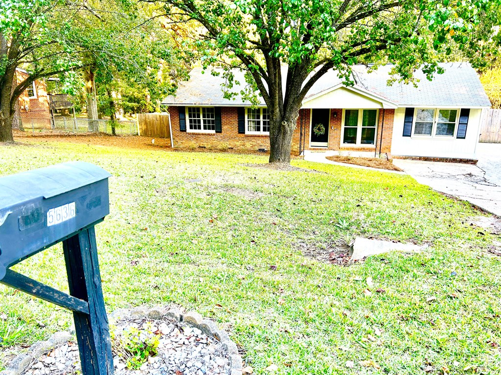 5636 Webb Avenue Columbus, GA 31909 - Photo 52 of 52 a front view of a house with a yard table and chairs