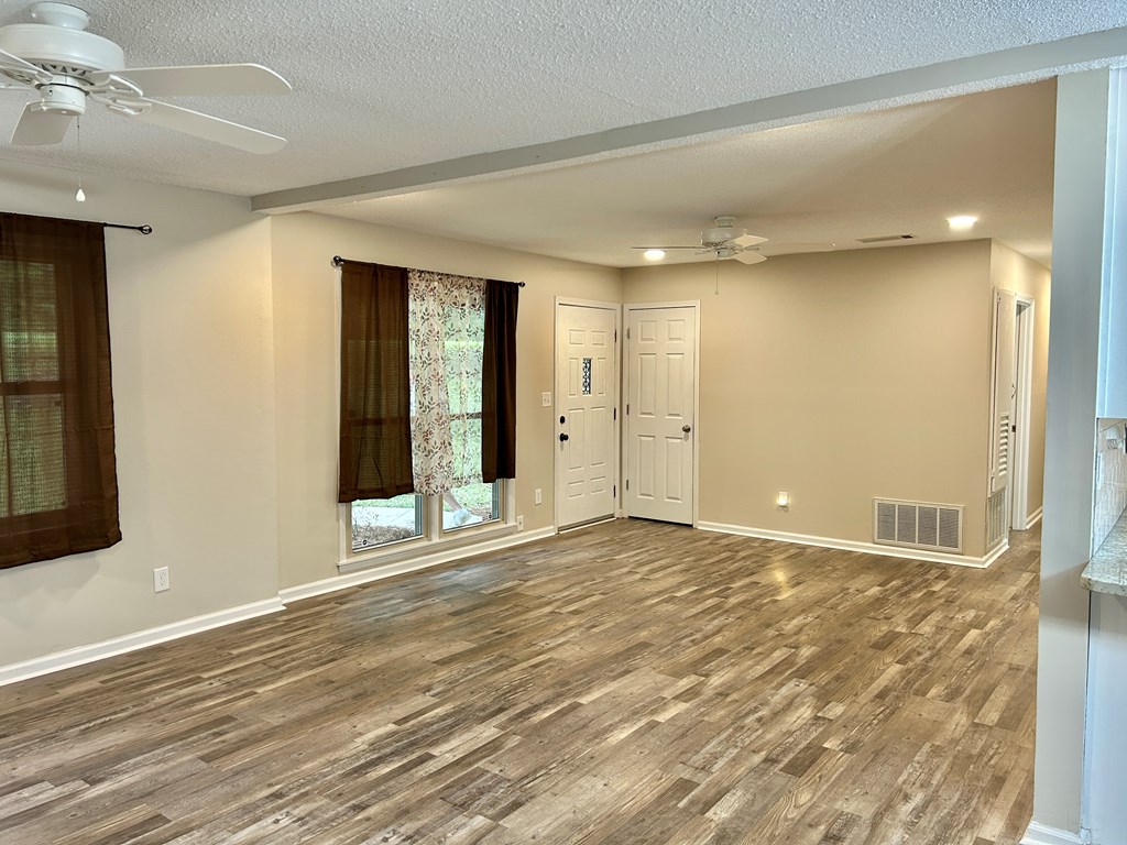 5636 Webb Avenue Columbus, GA 31909 - Photo 9 of 52 a view of an empty room with wooden floor and a window