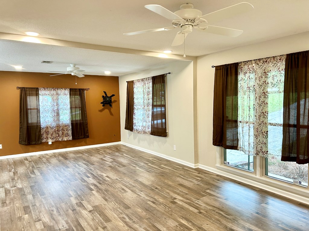 5636 Webb Avenue Columbus, GA 31909 - Photo 10 of 52 an empty room with large windows and a chandelier
