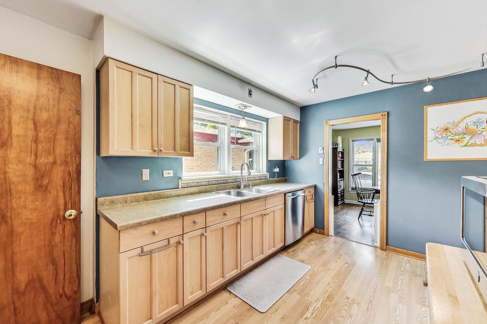 3312 Crain Street Skokie, IL 60076 - Photo 12 of 34 a large kitchen with a window