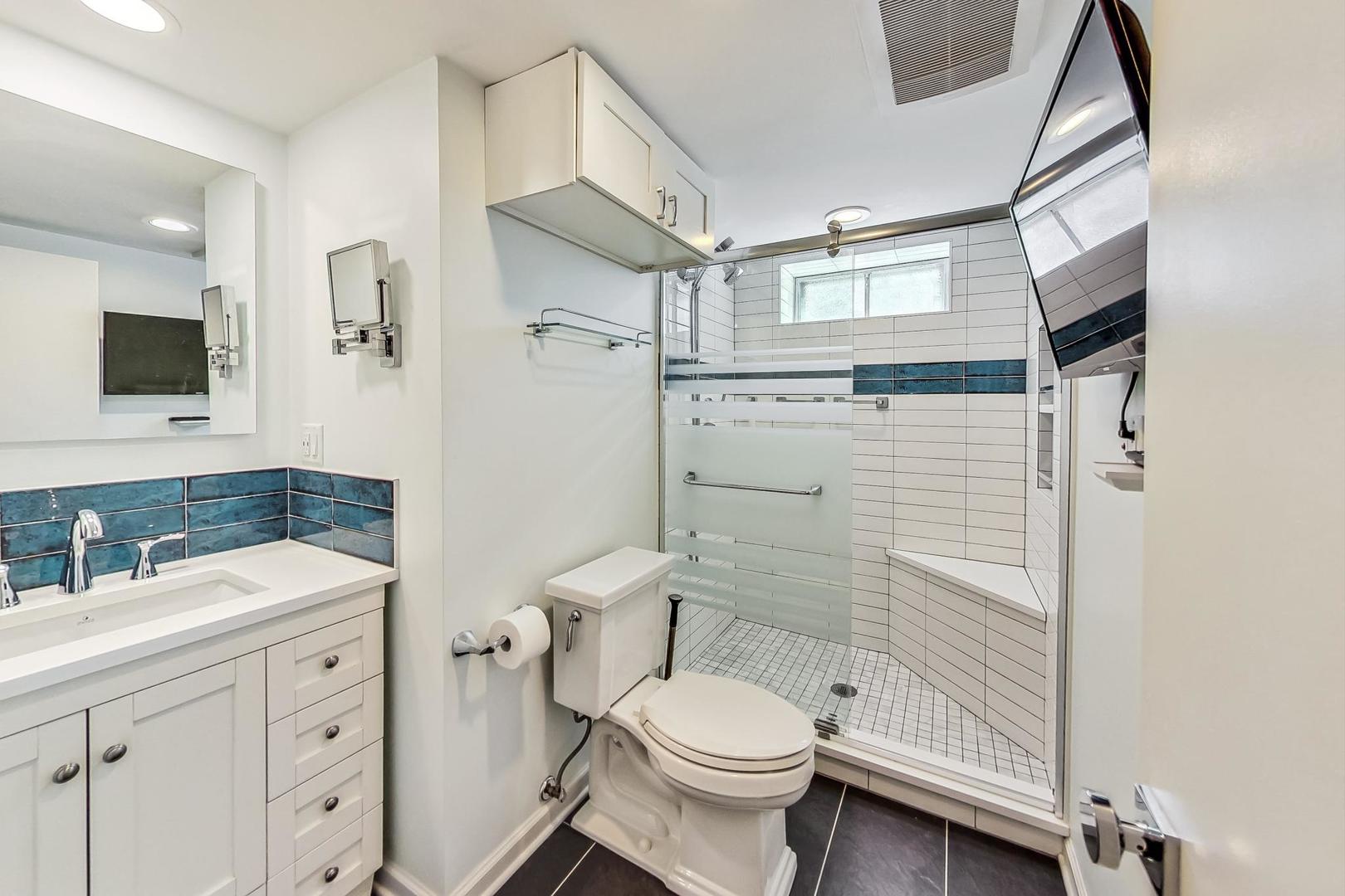 3312 Crain Street Skokie, IL 60076 - Photo 23 of 34 a bathroom with a sink a toilet and shower