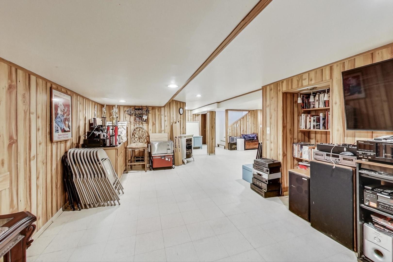 3312 Crain Street Skokie, IL 60076 - Photo 24 of 34 a room with furniture and a flat screen tv