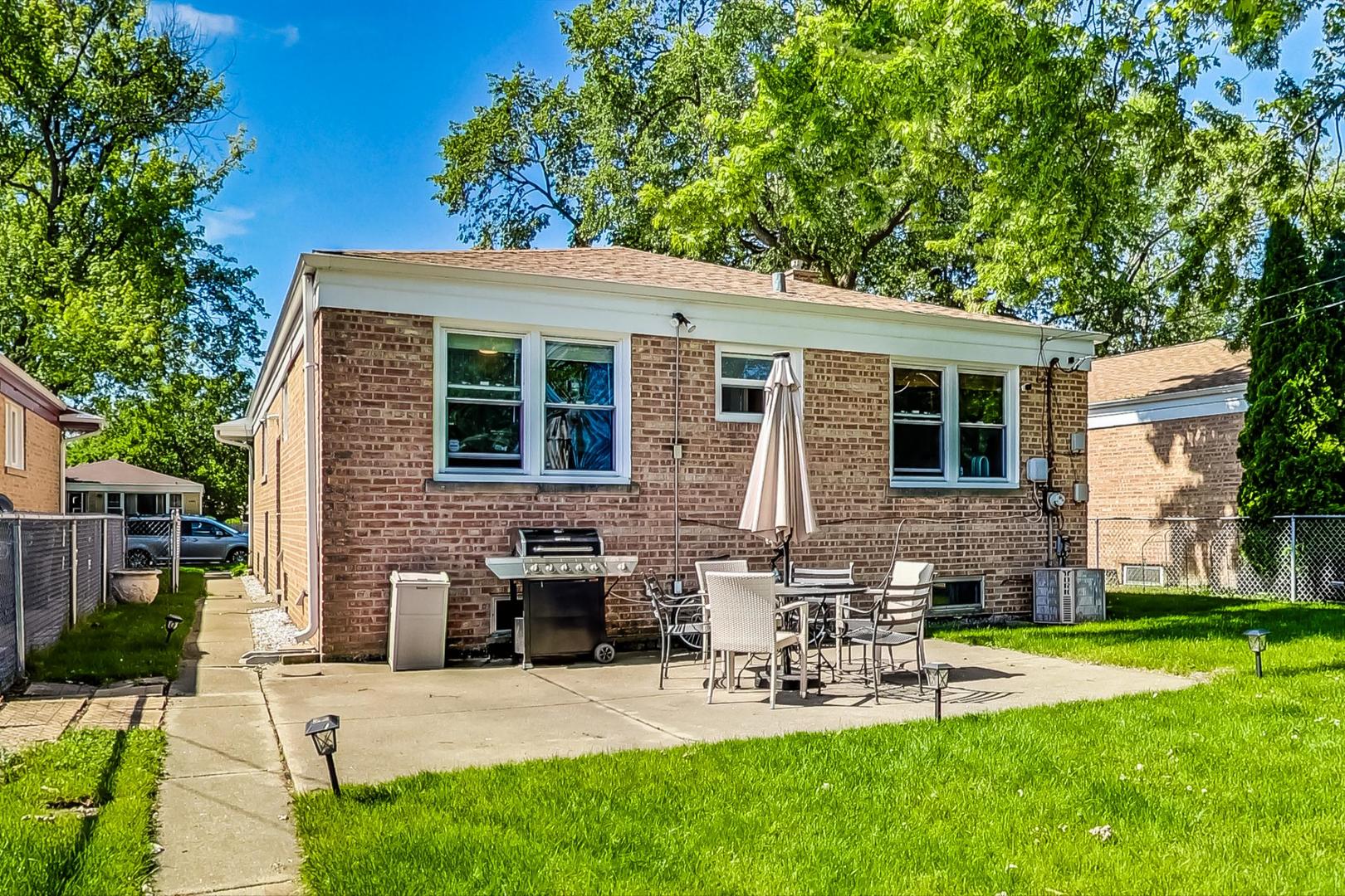 3312 Crain Street Skokie, IL 60076 - Photo 31 of 34 a view of a house with a yard porch and sitting area