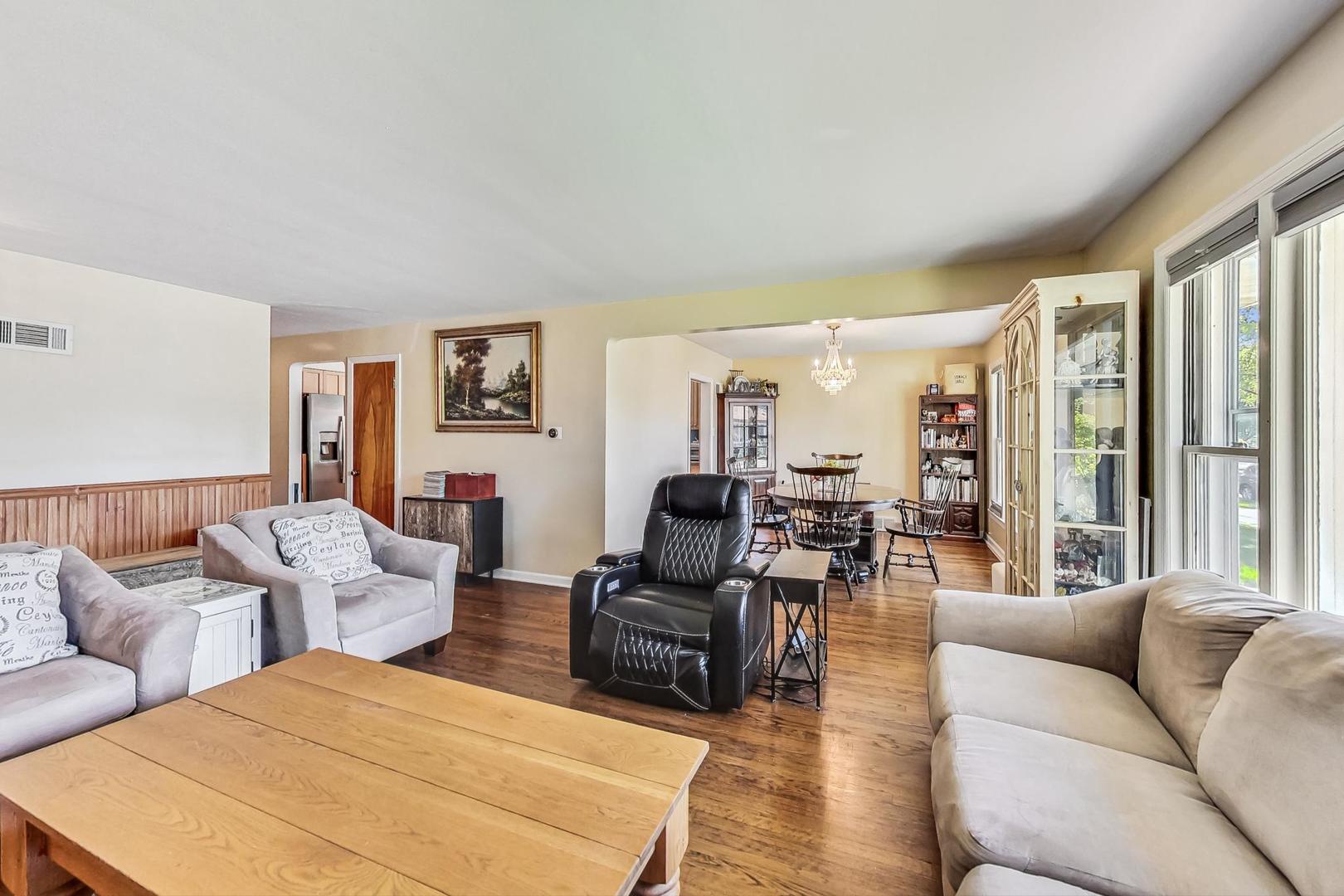 3312 Crain Street Skokie, IL 60076 - Photo 5 of 34 a living room with furniture and large windows