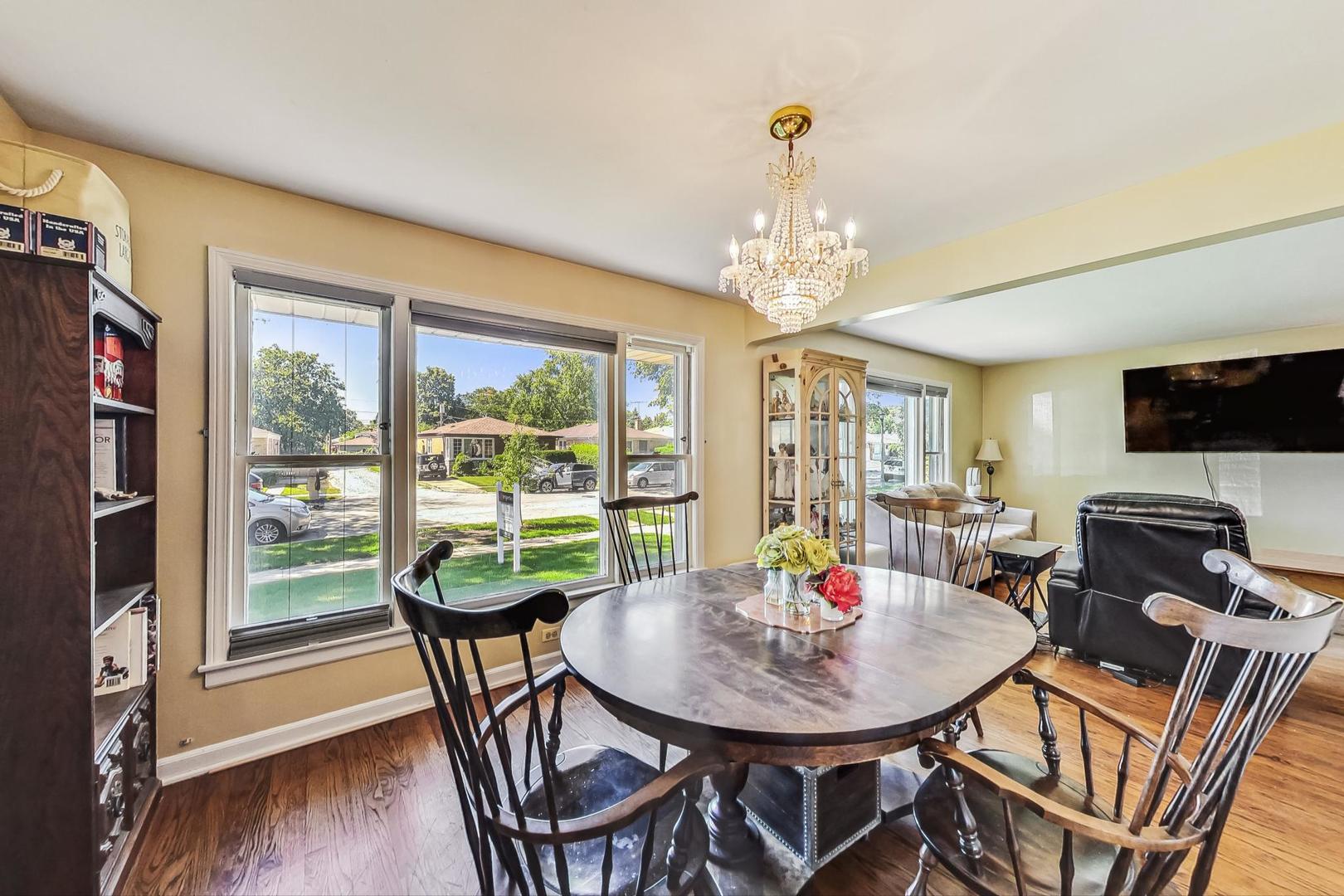 3312 Crain Street Skokie, IL 60076 - Photo 9 of 34 a view of a dining room with furniture window and outside view