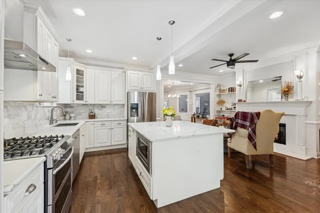 a kitchen with a stove a sink and a refrigerator