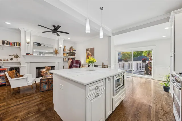 a kitchen with a stove and a wooden floors