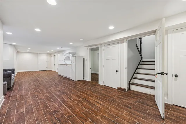 a view of a room with wooden floor and stairs