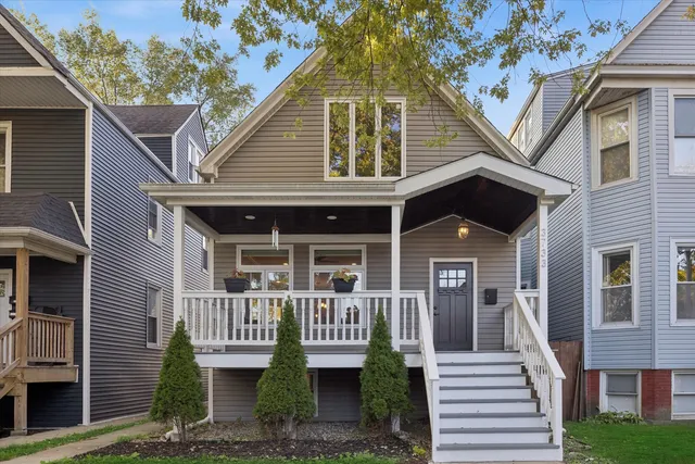 a view of a house with a small deck