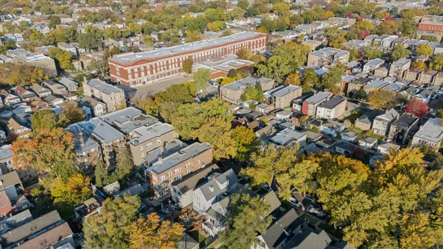 an aerial view of residential houses with outdoor space