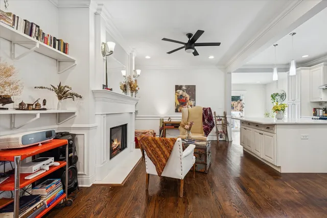 a living room with furniture a fireplace and a book shelf