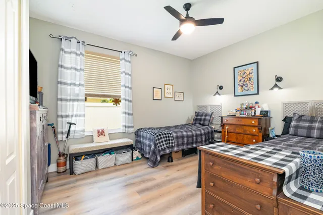 a bedroom with furniture and a window