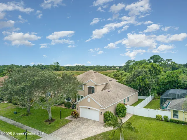 a view of house with outdoor space and garden