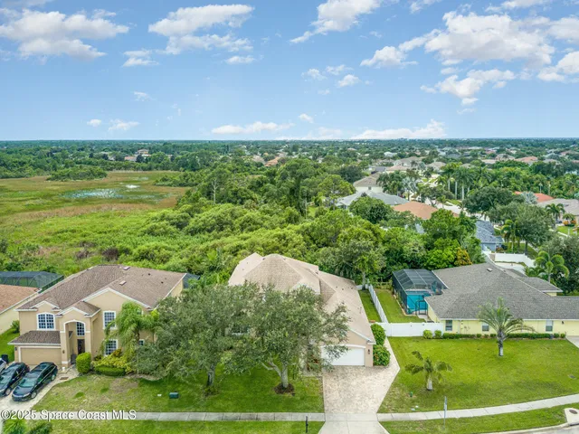 a front view of house with a garden