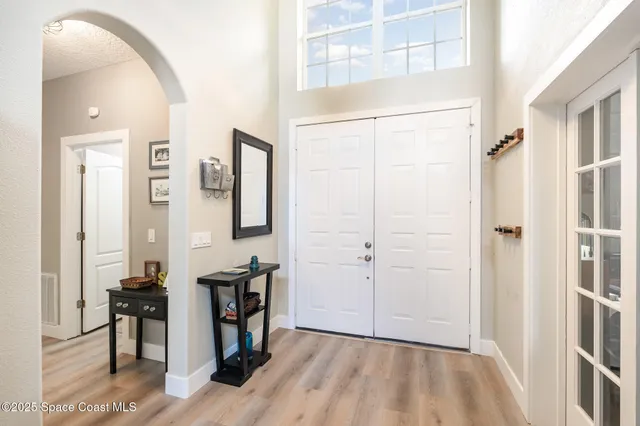wooden floor with table and chairs in wooden floor