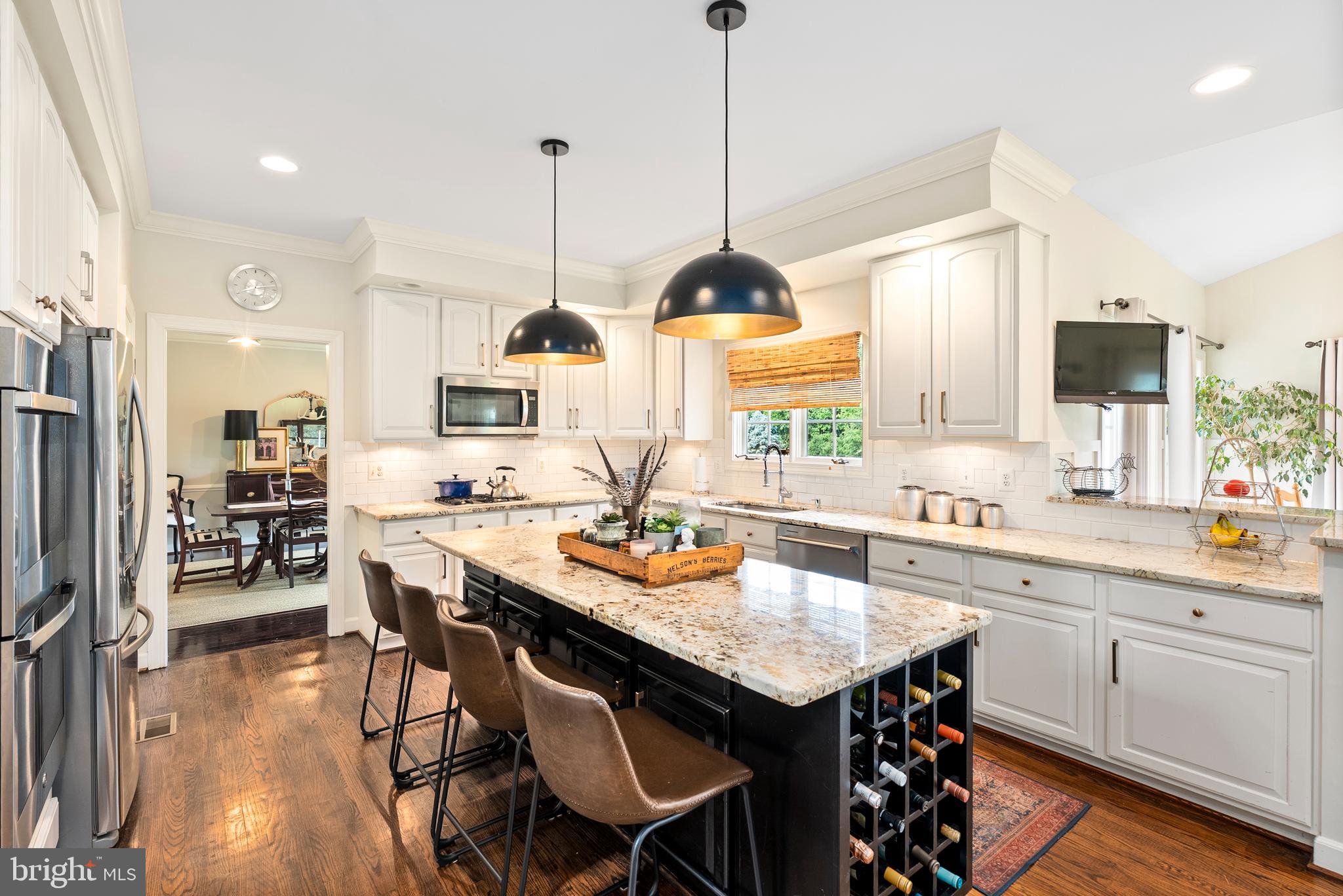 7 Redtree Lane Reisterstown, MD 21136 - Photo 18 of 56 a kitchen with a table chairs sink and cabinets