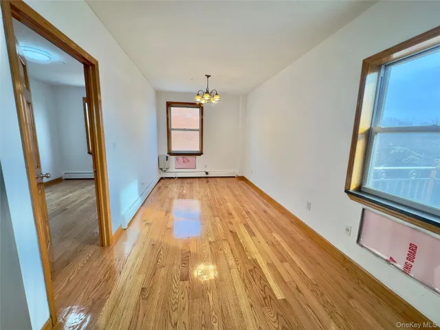 a view of a room with wooden floor and staircase