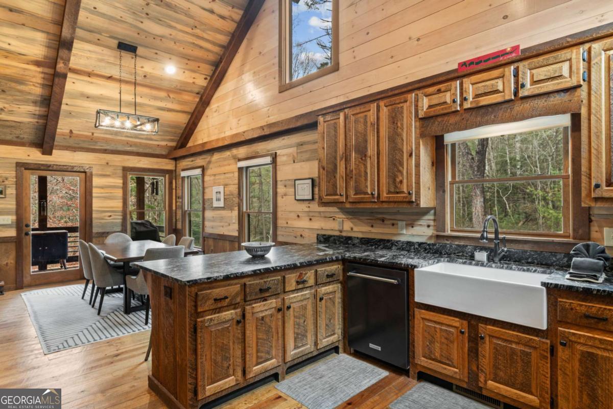15 Bootleg Mountain Road, Unit 11 Morganton, GA 30560 - Photo 17 of 67 a kitchen with stainless steel appliances granite countertop a sink and wooden cabinets