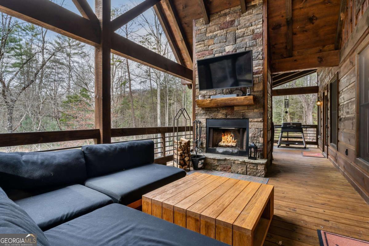 15 Bootleg Mountain Road, Unit 11 Morganton, GA 30560 - Photo 23 of 67 a living room with furniture and a fireplace