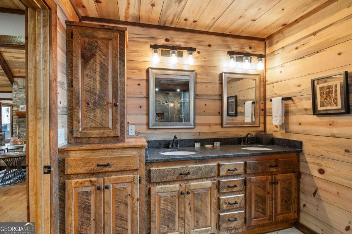 15 Bootleg Mountain Road, Unit 11 Morganton, GA 30560 - Photo 31 of 67 a bathroom with a granite countertop sink and a mirror