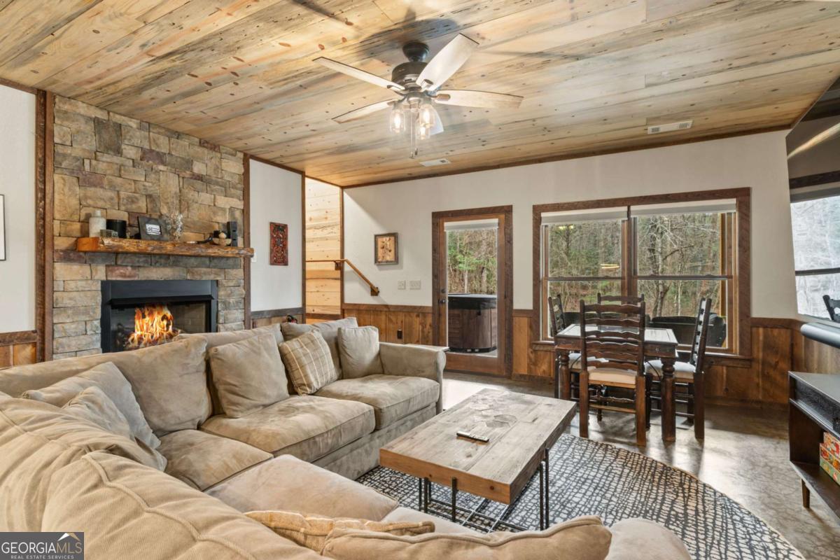 15 Bootleg Mountain Road, Unit 11 Morganton, GA 30560 - Photo 35 of 67 a living room with furniture and a fireplace
