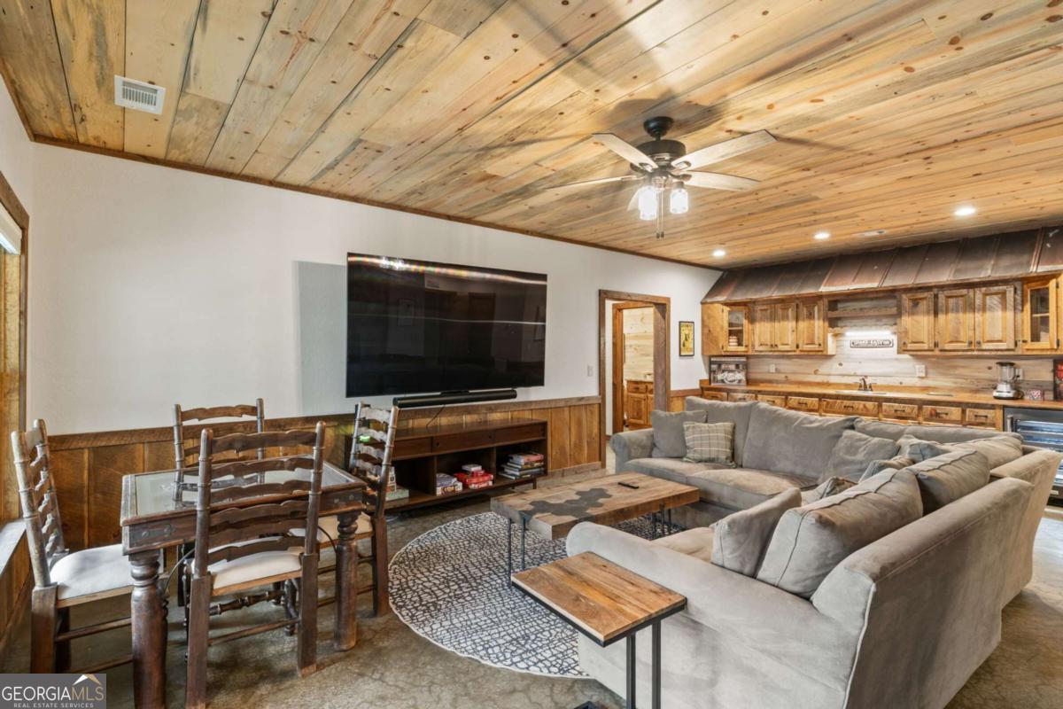 15 Bootleg Mountain Road, Unit 11 Morganton, GA 30560 - Photo 38 of 67 a living room with furniture and a flat screen tv