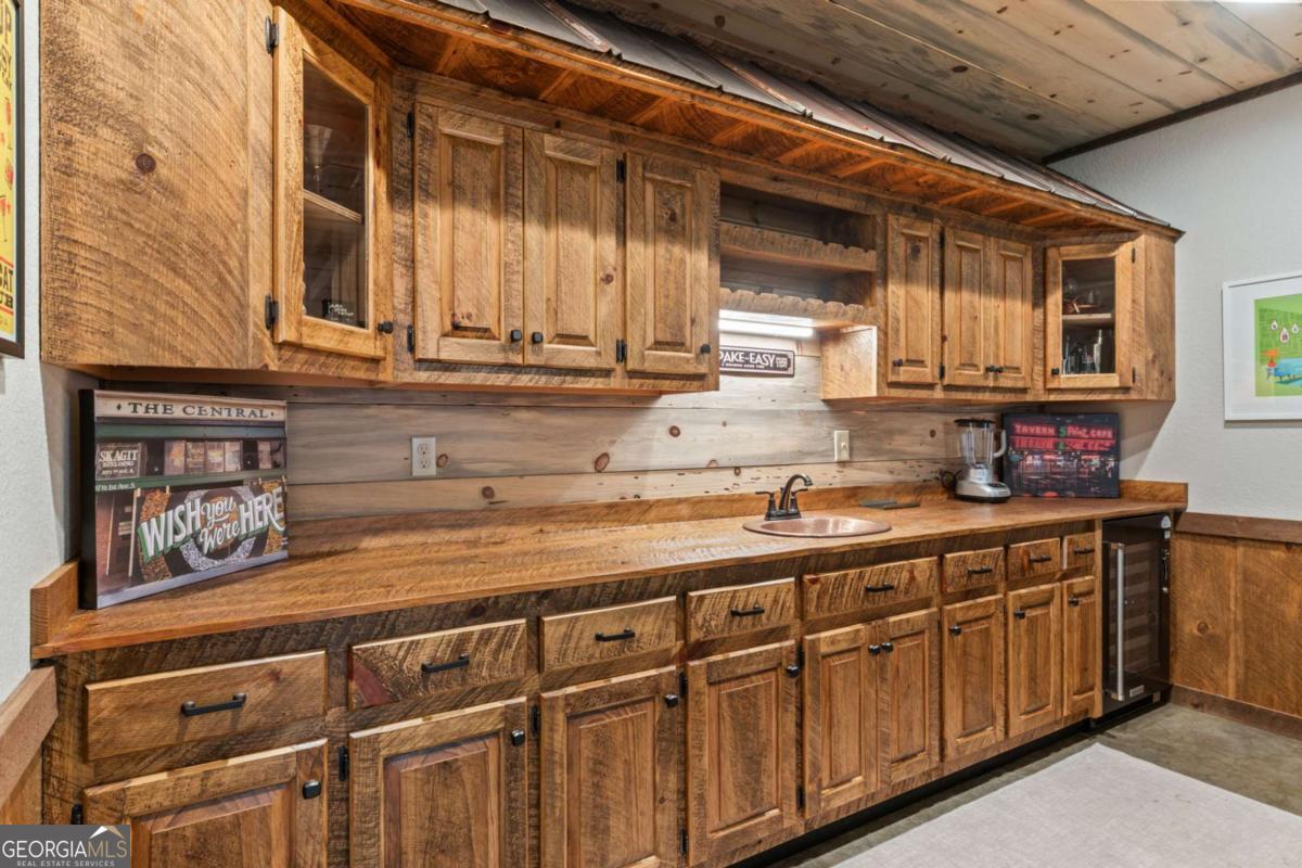 15 Bootleg Mountain Road, Unit 11 Morganton, GA 30560 - Photo 42 of 67 a kitchen with stainless steel appliances granite countertop a sink and cabinets
