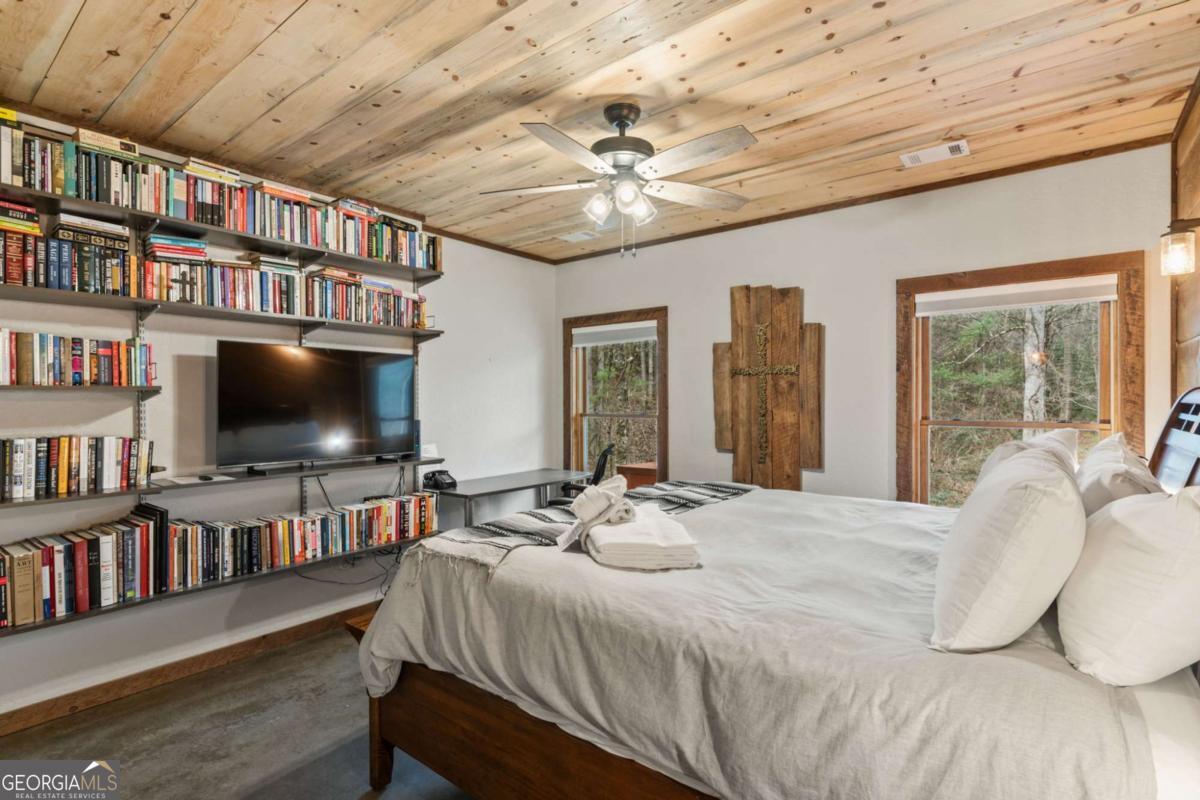 15 Bootleg Mountain Road, Unit 11 Morganton, GA 30560 - Photo 43 of 67 a bedroom with furniture and a flat screen tv