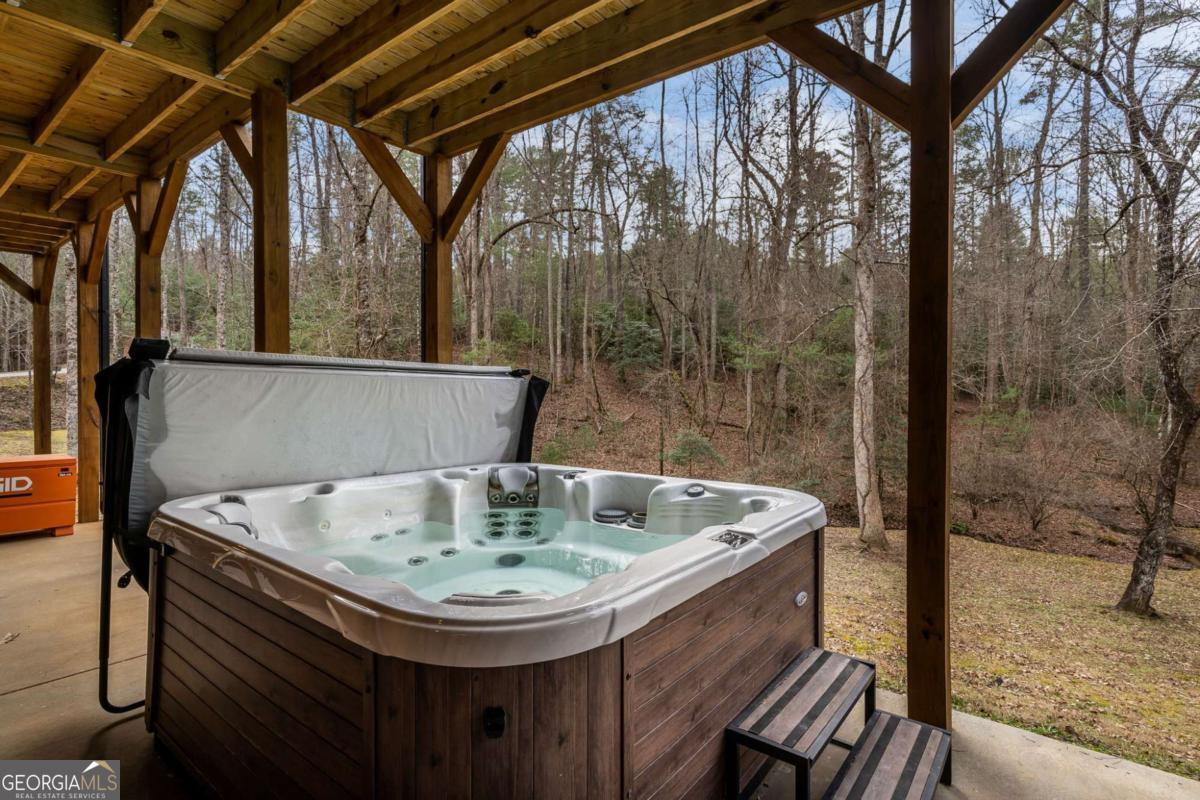 15 Bootleg Mountain Road, Unit 11 Morganton, GA 30560 - Photo 49 of 67 a bath tub sitting in a bathroom next to a sink