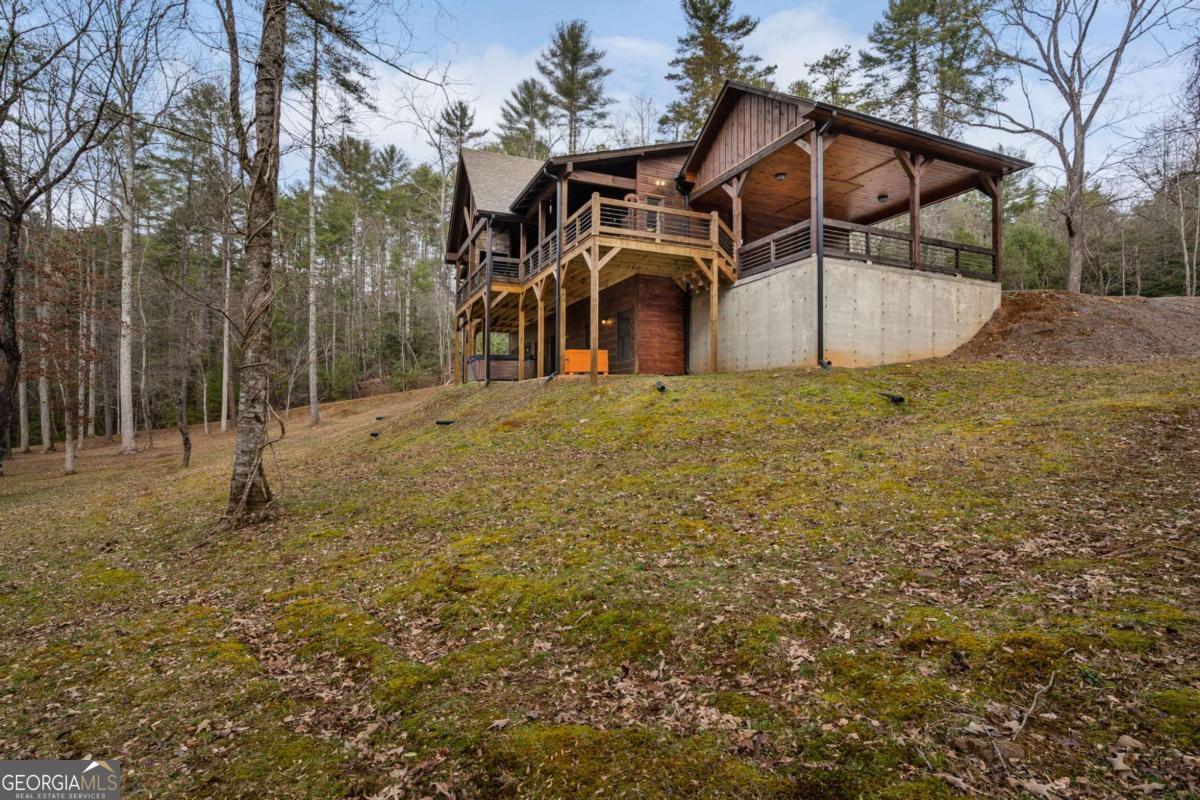 15 Bootleg Mountain Road, Unit 11 Morganton, GA 30560 - Photo 52 of 67 a front view of a house with a yard