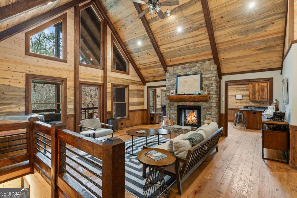 15 Bootleg Mountain Road, Unit 11 Morganton, GA 30560 - Photo 7 of 67 a living room with furniture a fireplace and wooden floor