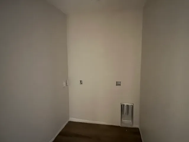 a view of a backyard with large trees