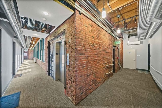 a bathroom with a glass shower door and a mirror