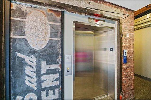 an outdoor view with swimming pool and seating space