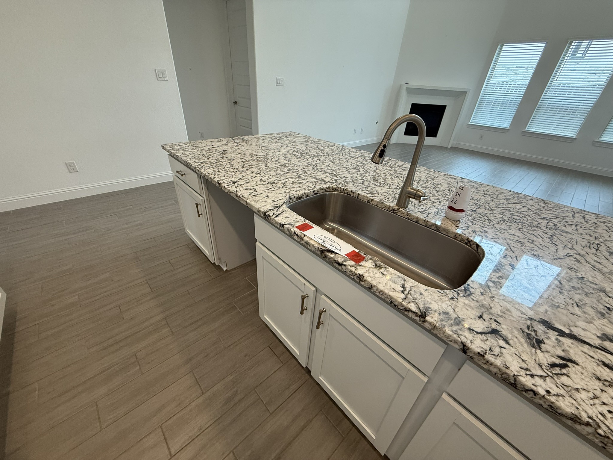 7802 Wayman Pass Fulshear, TX 77441 - Photo 15 of 50 a kitchen with a stove and a sink
