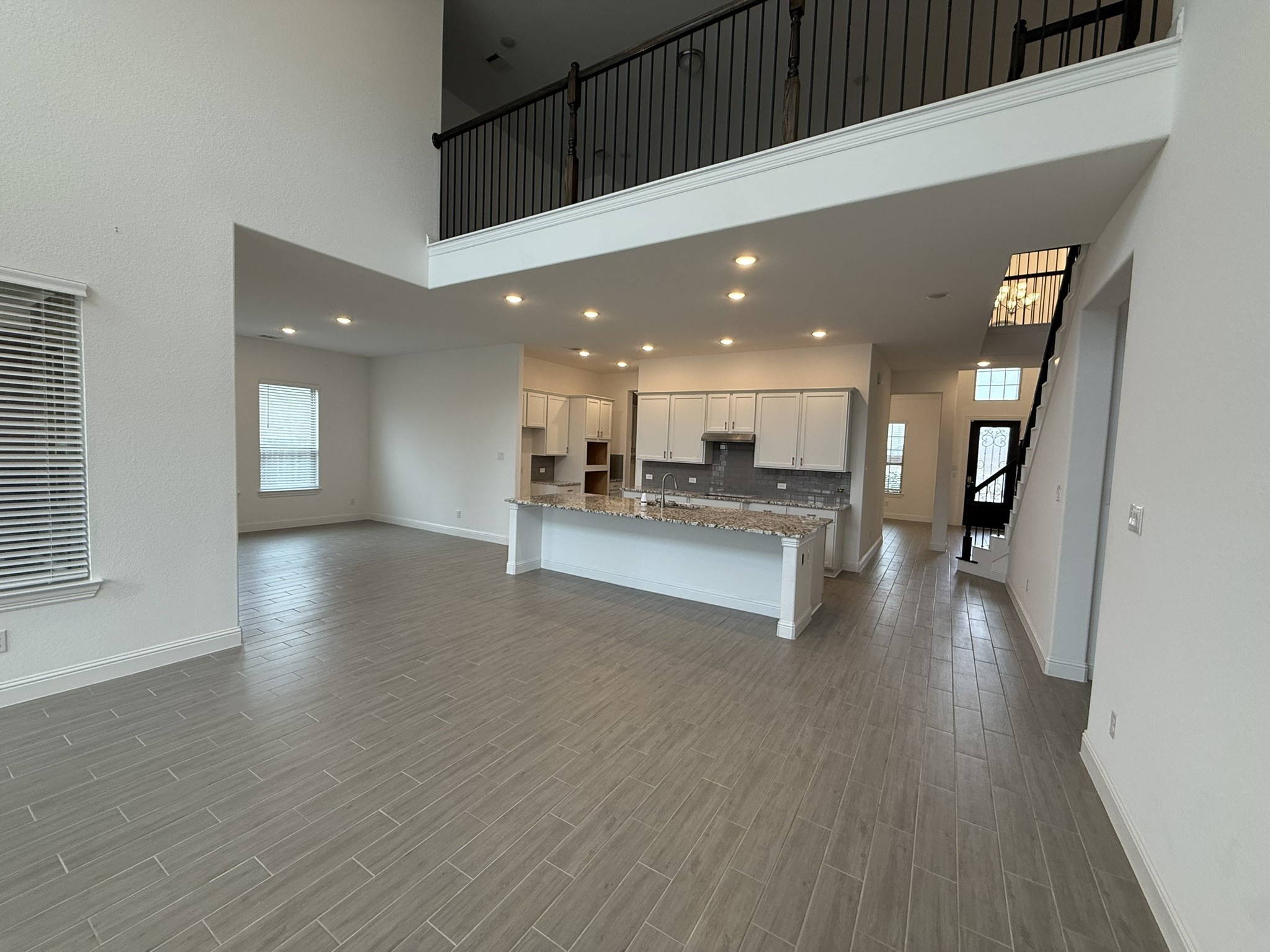 7802 Wayman Pass Fulshear, TX 77441 - Photo 16 of 50 a view of kitchen with kitchen island and stainless steel appliances