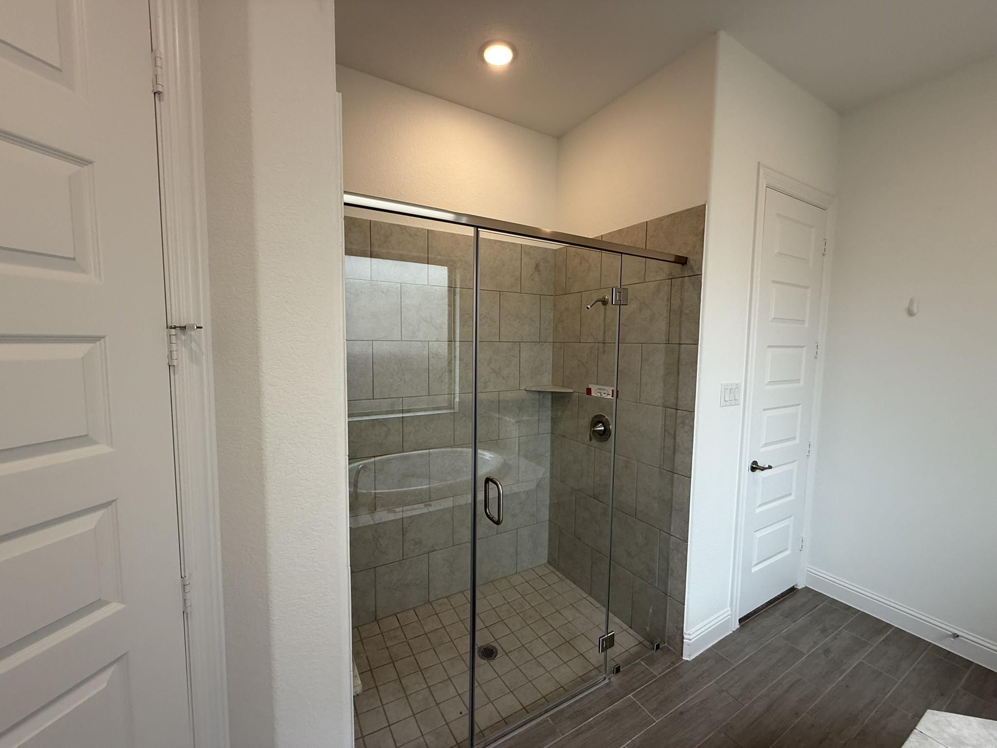 7802 Wayman Pass Fulshear, TX 77441 - Photo 30 of 50 a bathroom with a shower and a glass door